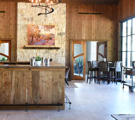 Tasting room bar at Adelaida with people enjoying wine